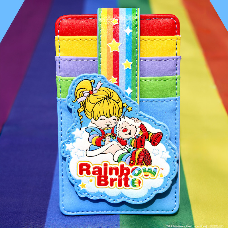 Loungefly Rainbow Brite Cloud Card Holder featuring different color card slots and a strap that comes over and snaps into place with Rainbow Brite and Twink sitting on a cloud